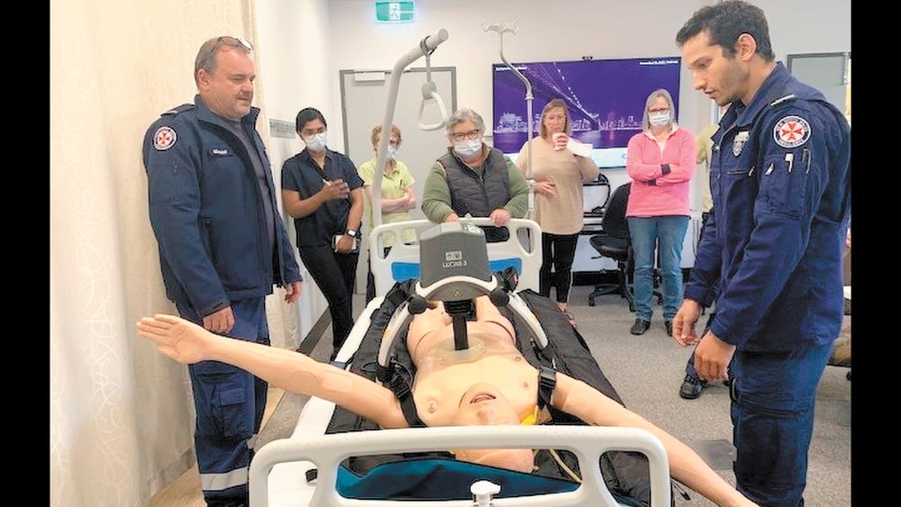 Ambulance officers demo CPR machine post image